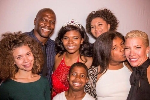 A picture of Rebecca King-Crews with her husband and children.